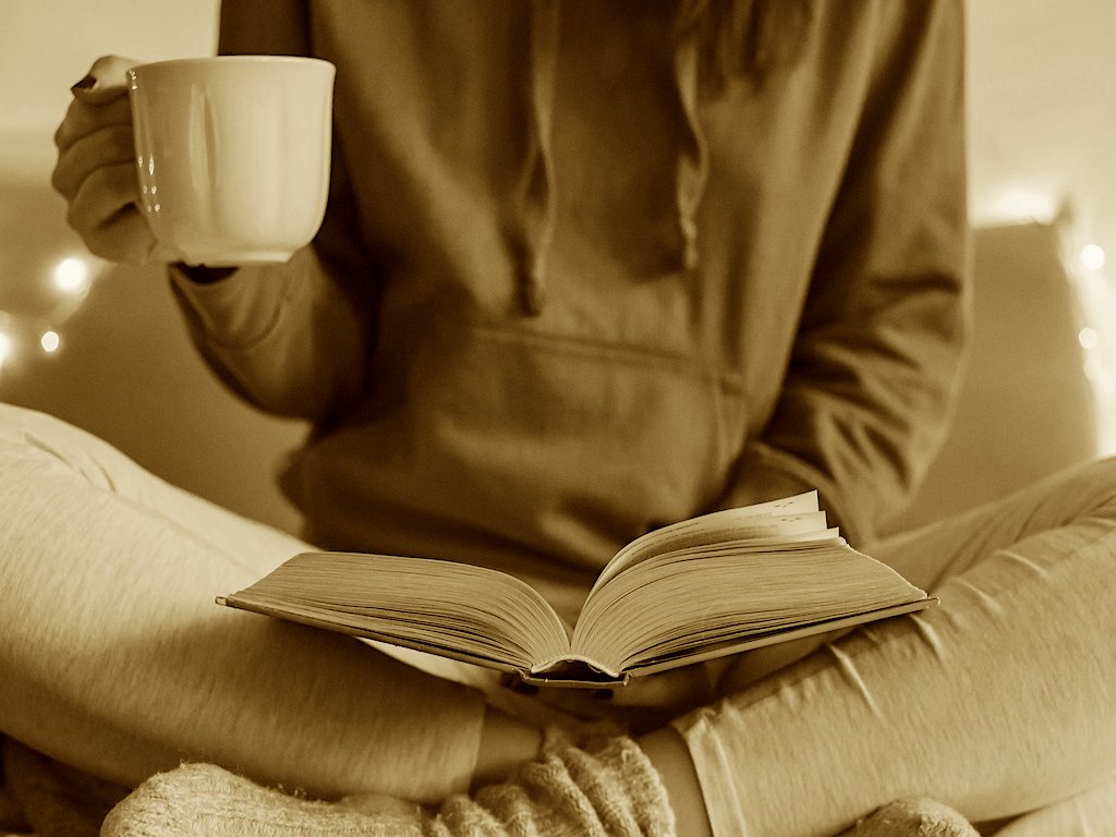 Girl with a book and coffee